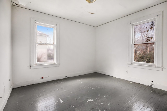 empty room with dark hardwood / wood-style floors