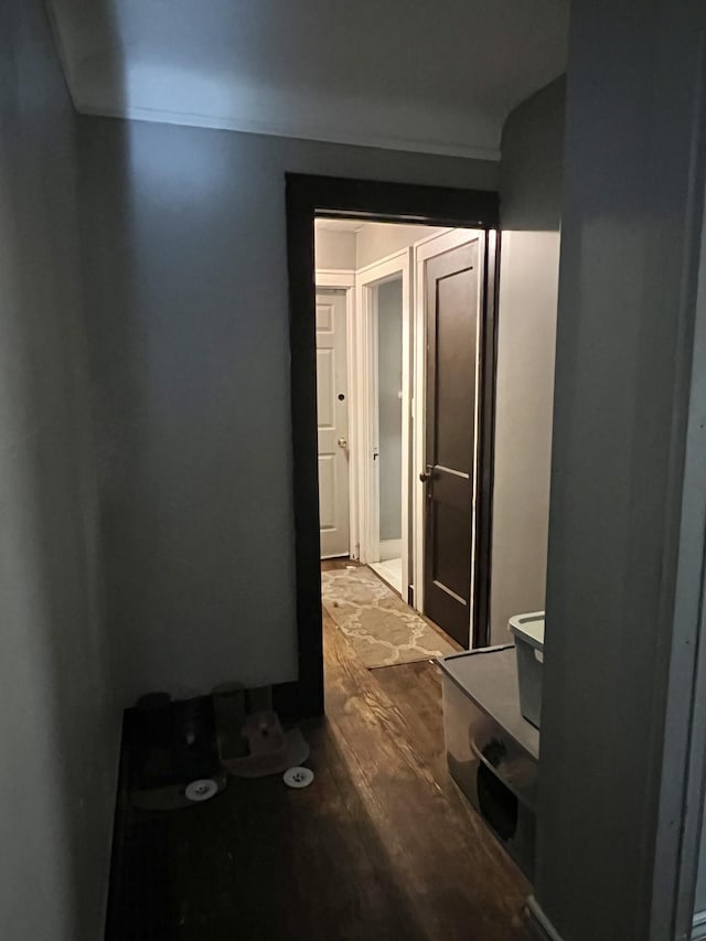 hallway with hardwood / wood-style flooring