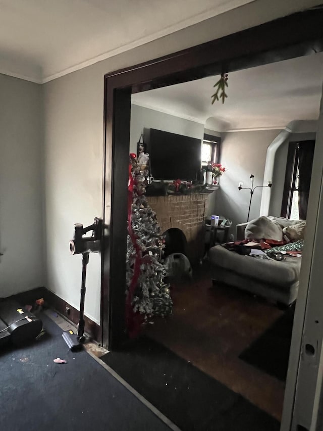 bedroom featuring a fireplace and ornamental molding