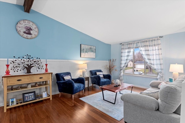 living room featuring dark hardwood / wood-style floors and vaulted ceiling with beams