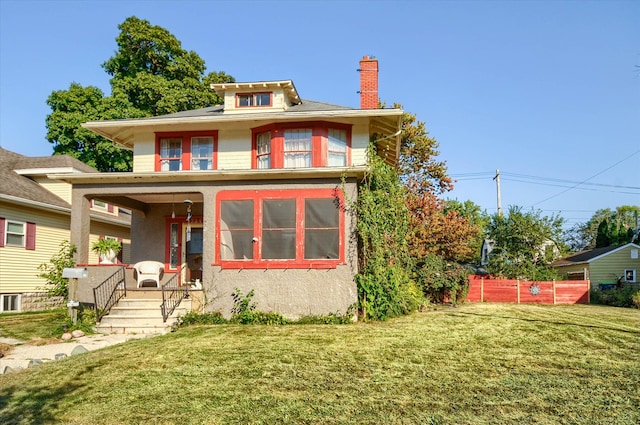 view of front facade featuring covered porch and a front lawn