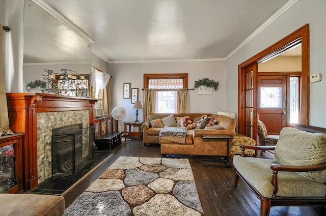 living room featuring a fireplace, dark hardwood / wood-style floors, plenty of natural light, and ornamental molding