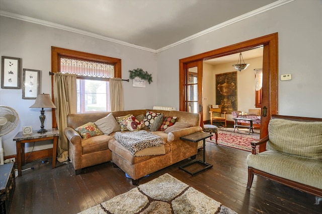 living room with dark hardwood / wood-style flooring and crown molding