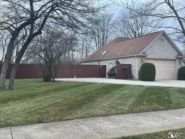 view of property exterior with a garage and a lawn