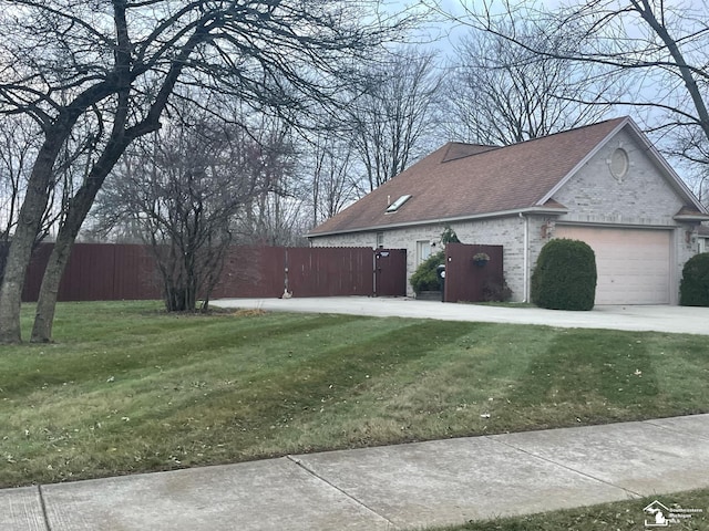 26926 Reaume, Trenton, MI 48183 - view of side of home featuring a garage, brick siding, and a shingled roof