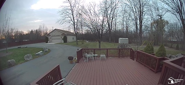 deck at dusk with a lawn