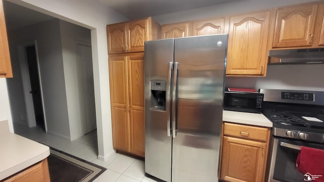 26926 Reaume, Trenton, MI 48183 - kitchen featuring appliances with stainless steel finishes, under cabinet range hood, light tile patterned floors, and light countertops