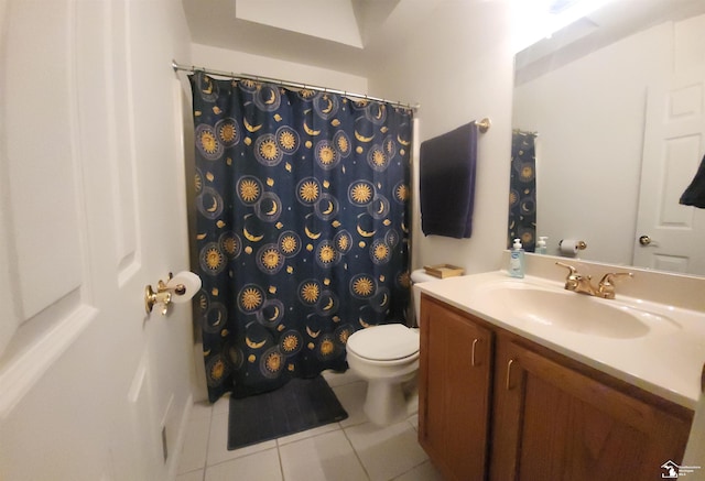 bathroom with vanity, tile patterned floors, and toilet