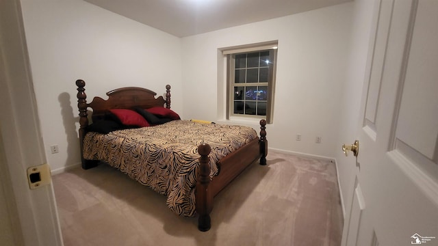 bedroom featuring light colored carpet