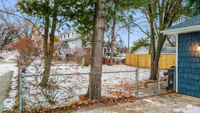 view of yard layered in snow