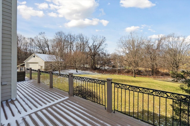 wooden deck with a yard and a garage