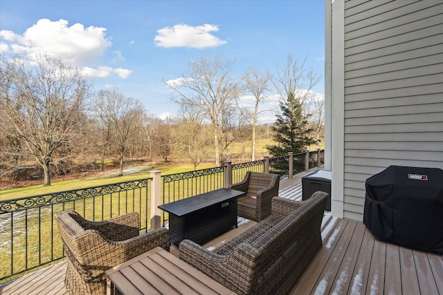 wooden terrace featuring a yard and grilling area