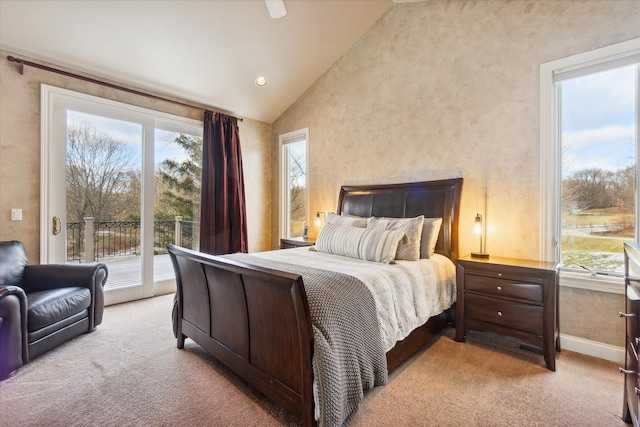 carpeted bedroom featuring high vaulted ceiling, ceiling fan, and access to outside