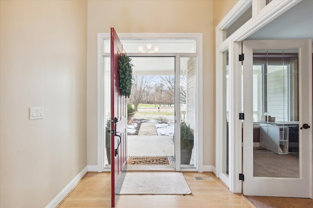 entrance foyer with light wood-type flooring