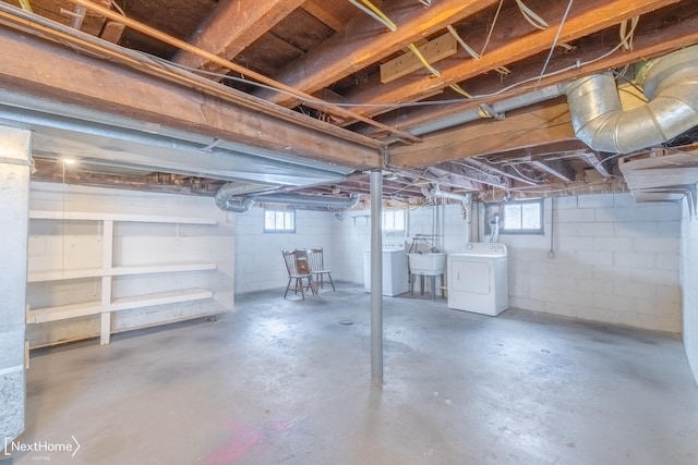 basement with washer / clothes dryer and sink