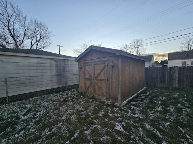 outdoor structure at dusk with a lawn