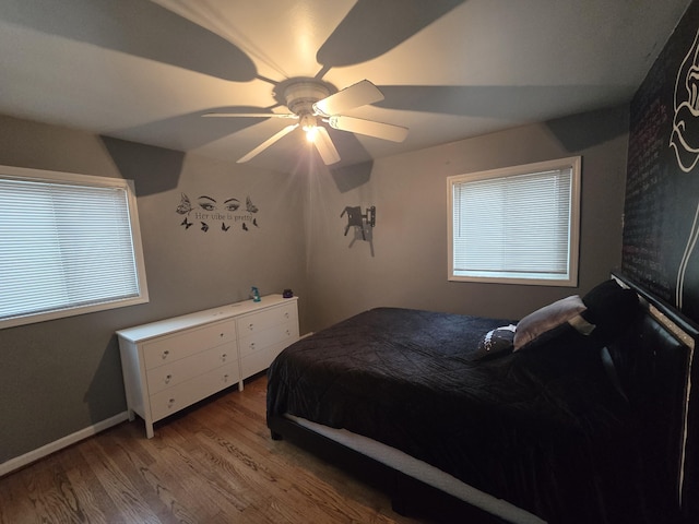 bedroom featuring hardwood / wood-style floors and ceiling fan