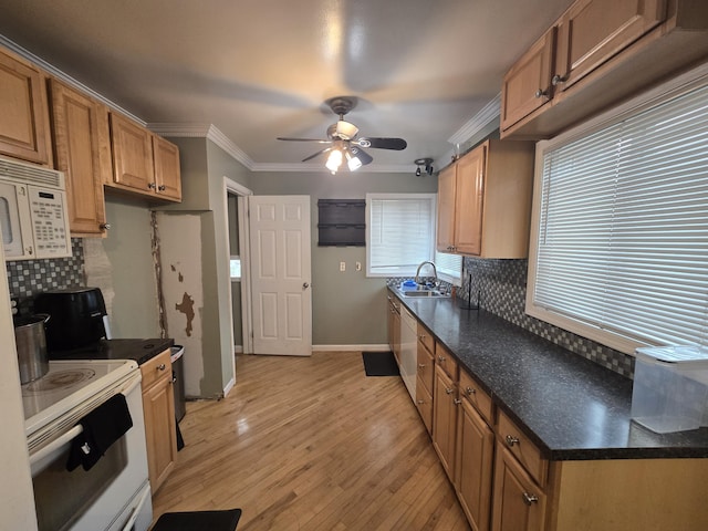 kitchen featuring light wood-type flooring, decorative backsplash, white appliances, and crown molding