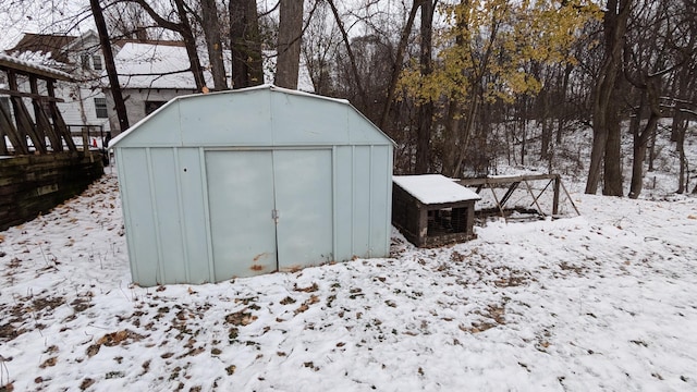 2521 Hillside Dr NW, Grand Rapids, MI 49544 - snow covered structure featuring a shed