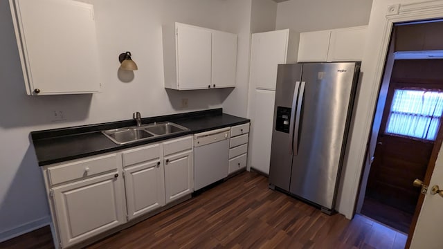 2521 Hillside Dr NW, Grand Rapids, MI 49544 - kitchen with stainless steel fridge with ice dispenser, dishwasher, a sink, dark wood-style flooring, and white cabinetry