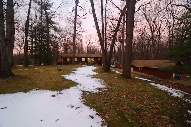 view of yard at dusk