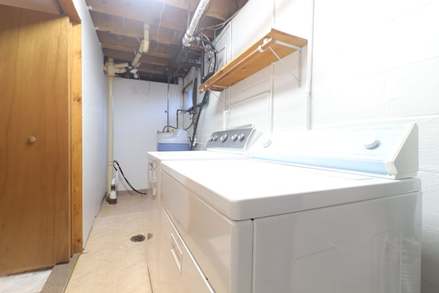 laundry area featuring washing machine and clothes dryer