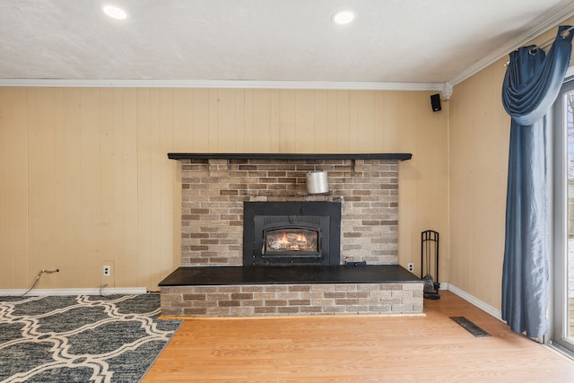 details with wood walls, wood-type flooring, and crown molding