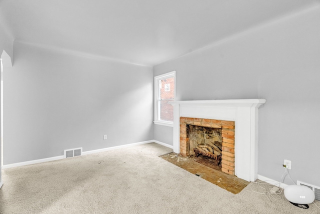 unfurnished living room featuring carpet floors