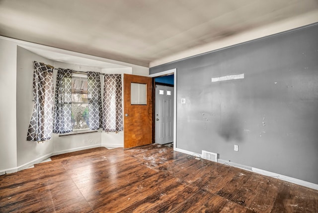 unfurnished room featuring hardwood / wood-style flooring