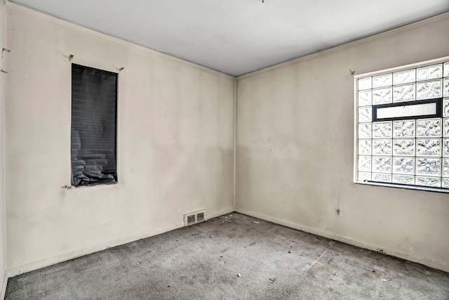 unfurnished room featuring carpet flooring and ornamental molding