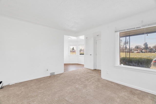 unfurnished room with carpet flooring