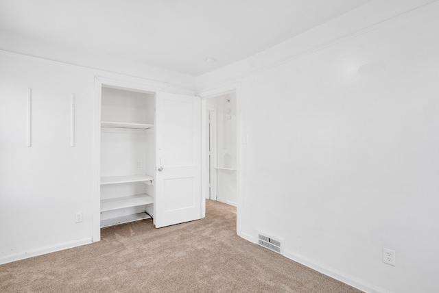 unfurnished bedroom with light carpet