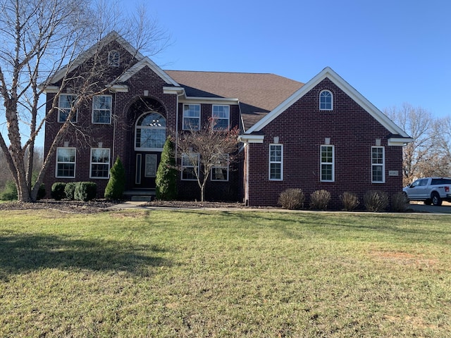 view of property with a front lawn