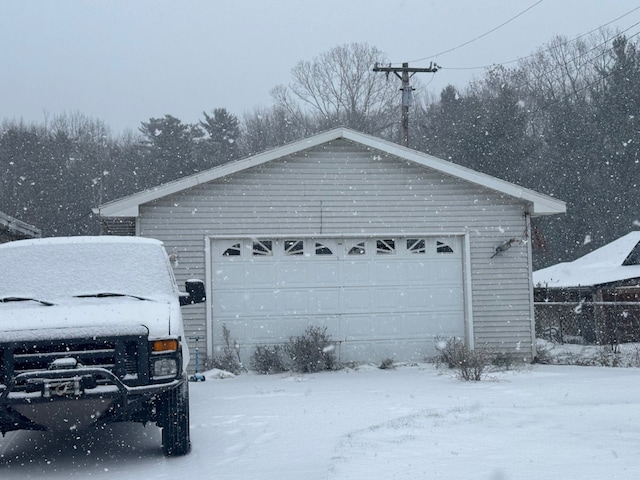 view of snow covered garage