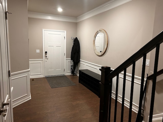 2785 Tulip Way, Commerce Twp, MI 48382 - foyer entrance with ornamental molding, dark wood-style floors, wainscoting, stairs, and a decorative wall