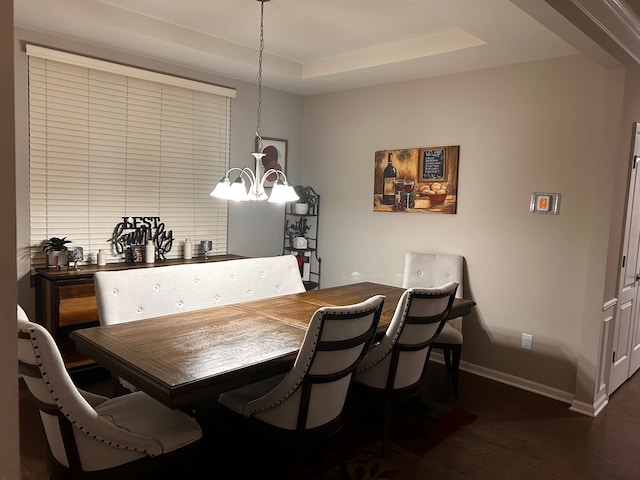 2785 Tulip Way, Commerce Twp, MI 48382 - dining room featuring dark wood-style floors, a raised ceiling, and a chandelier