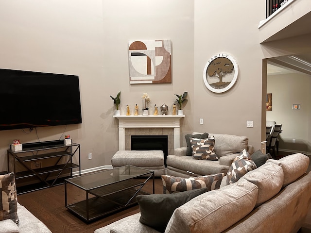 2785 Tulip Way, Commerce Twp, MI 48382 - living room featuring wood finished floors, a tiled fireplace, and a high ceiling