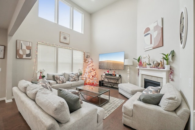 2785 Tulip Way, Commerce Twp, MI 48382 - living room with a towering ceiling, dark wood-type flooring, and a tiled fireplace