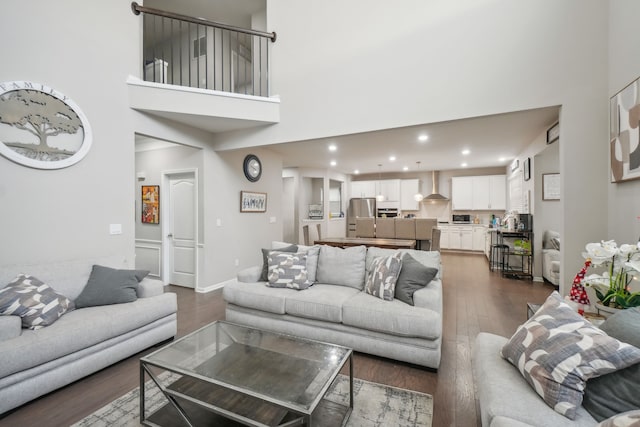 2785 Tulip Way, Commerce Twp, MI 48382 - living room featuring a high ceiling, dark wood-style flooring, and recessed lighting