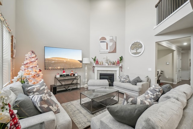 2785 Tulip Way, Commerce Twp, MI 48382 - living area featuring a towering ceiling, wood finished floors, and a fireplace