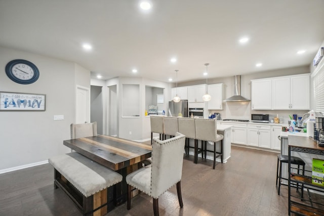 dining area featuring dark wood-type flooring