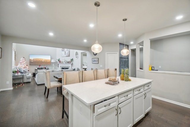 2785 Tulip Way, Commerce Twp, MI 48382 - kitchen with a kitchen island, dark wood-style flooring, recessed lighting, light countertops, and white cabinets