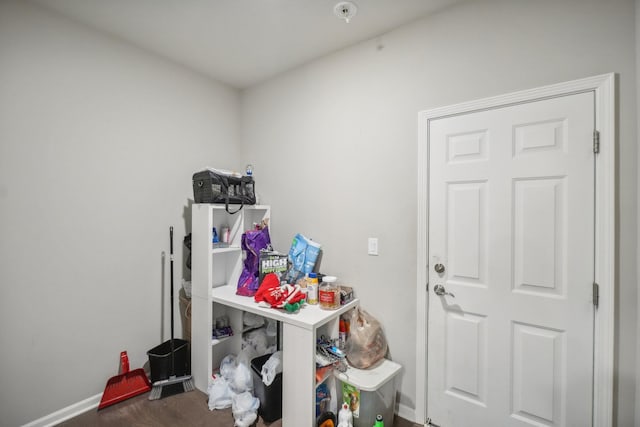 laundry room with dark hardwood / wood-style floors