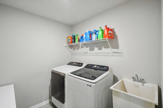 2785 Tulip Way, Commerce Twp, MI 48382 - laundry area featuring separate washer and dryer and baseboards