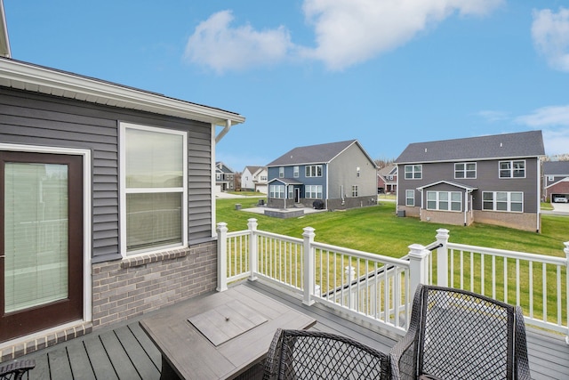 wooden deck featuring a yard