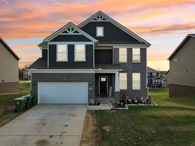 craftsman inspired home featuring a yard and a garage