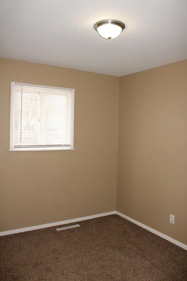 empty room featuring carpet flooring