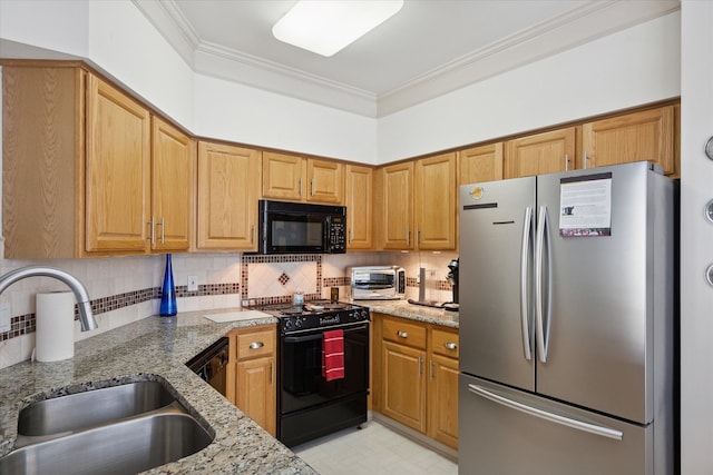 kitchen with black appliances, light stone countertops, ornamental molding, and sink