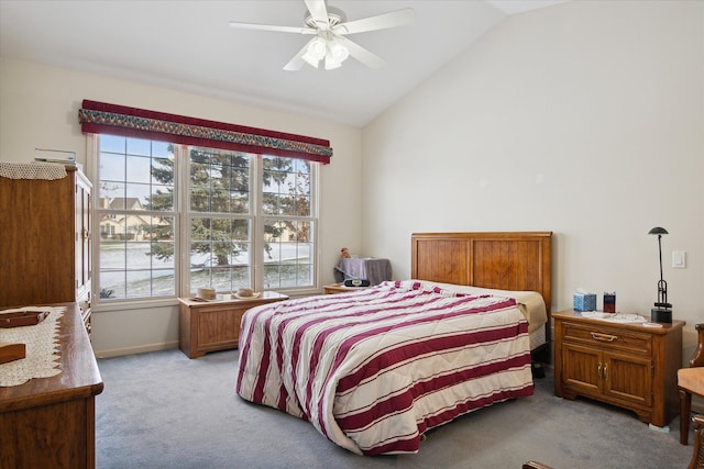 bedroom featuring ceiling fan, light colored carpet, and lofted ceiling