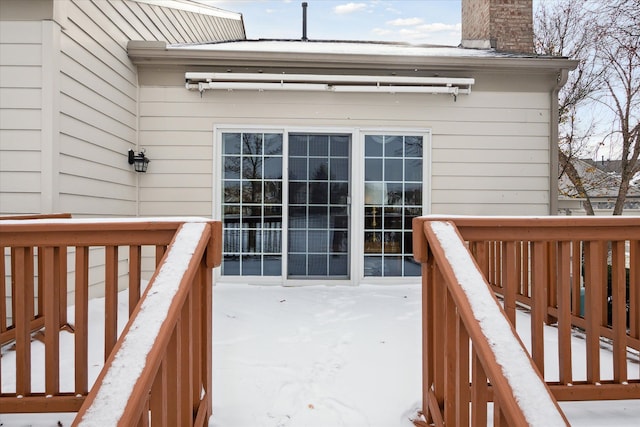 view of snow covered deck